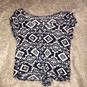 Blue and white patterned top with knot